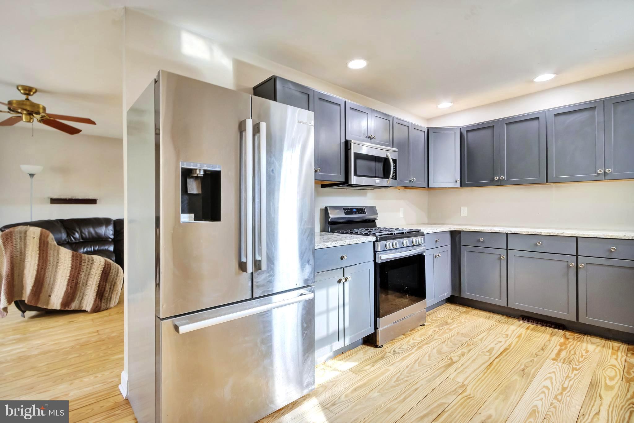 18526 Cool Spring Road Milton, DE 19968 - Photo 9 of 70 a kitchen with stainless steel appliances granite countertop a refrigerator sink and stove