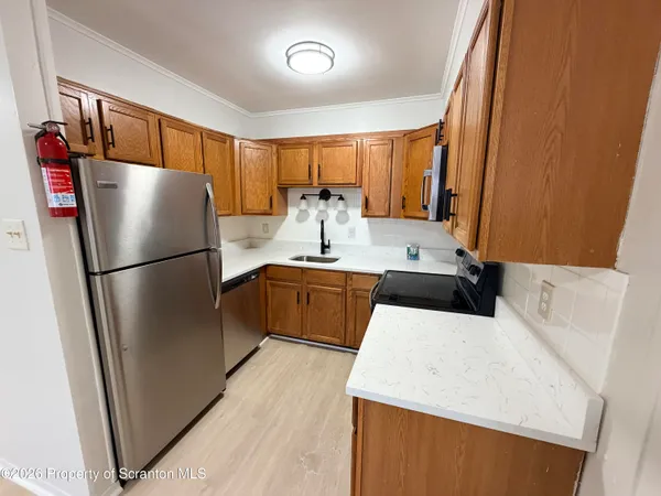 a kitchen with a refrigerator a sink and a refrigerator