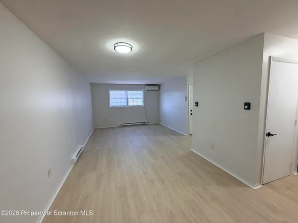a view of an empty room and window
