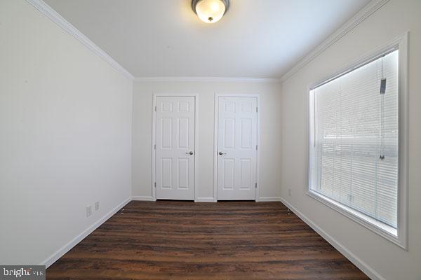 17 Edgewater Drive Magnolia, DE 19962 - Photo 6 of 10 a view of an empty room with wooden floor and a window