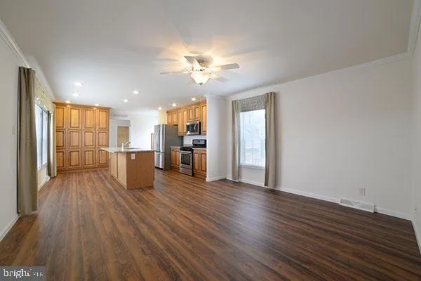 a view of kitchen with wooden floor