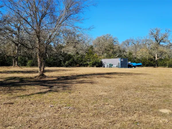 a view of a backyard of the house
