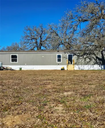 a front view of house with yard
