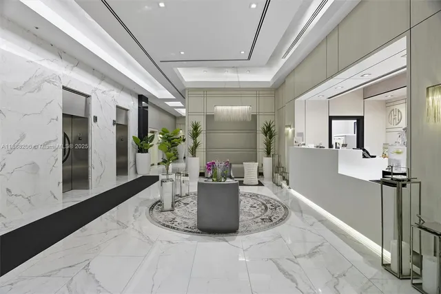 a dining room with furniture and a potted plant