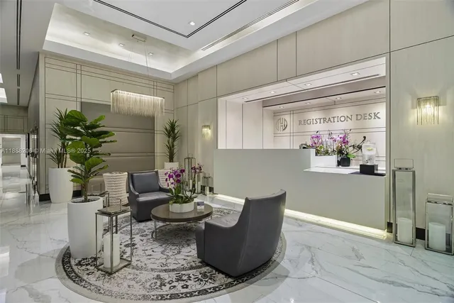 a living room with furniture and flowers