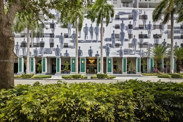 front view of a building with a garden