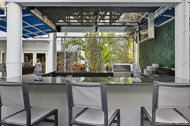 a kitchen with a table and chairs