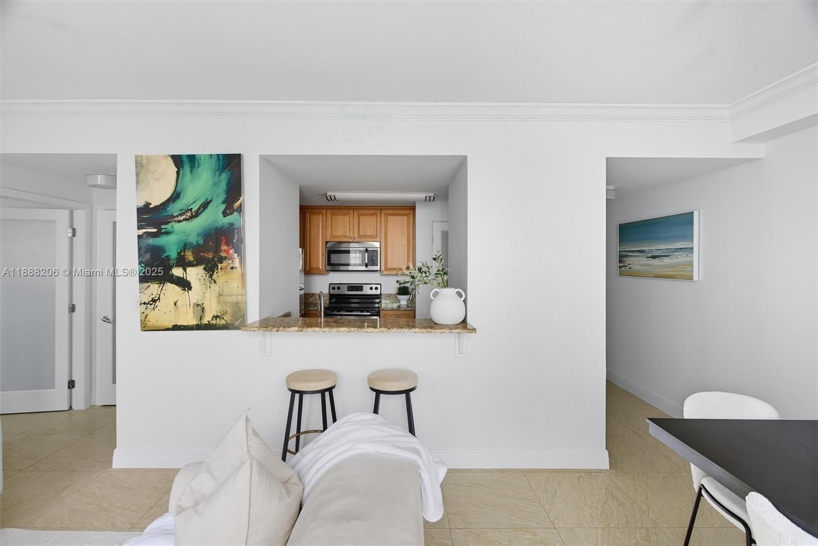 185 Southeast 14th Terrace, Unit 1709 Miami, FL 33131 - Photo 6 of 31 a living room with furniture and a potted plant