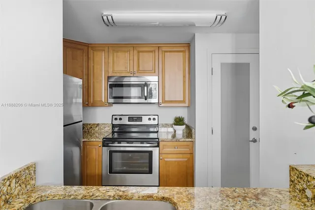 a kitchen with a stove microwave and refrigerator