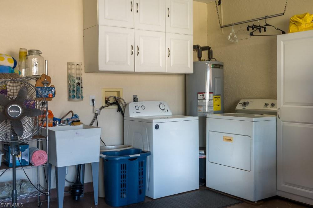 8382 Butternut Road Fort Myers, FL 33967 - Photo 15 of 19 a view of storage and utility room with washer and dryer