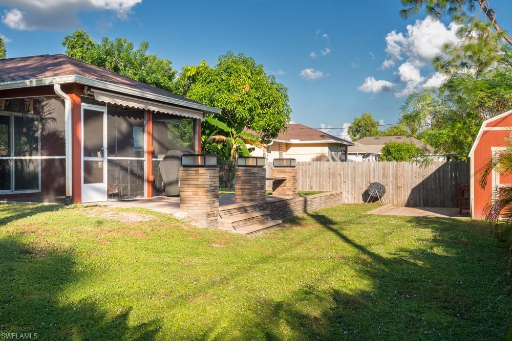 8382 Butternut Road Fort Myers, FL 33967 - Photo 18 of 19 a view of a house with backyard and sitting area