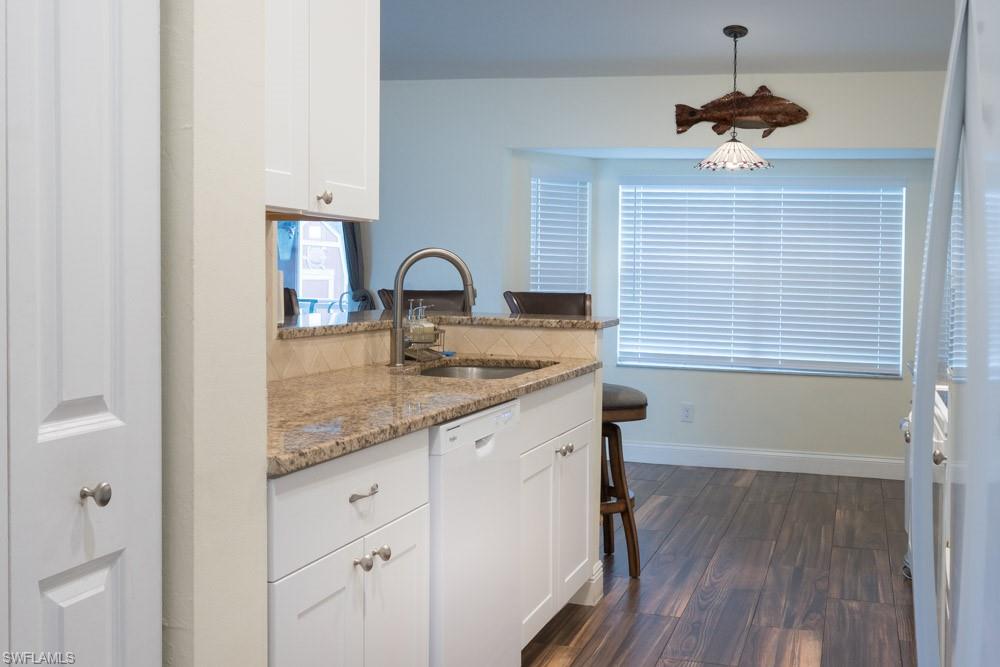 8382 Butternut Road Fort Myers, FL 33967 - Photo 5 of 19 a bathroom with a granite countertop sink a vanity and window