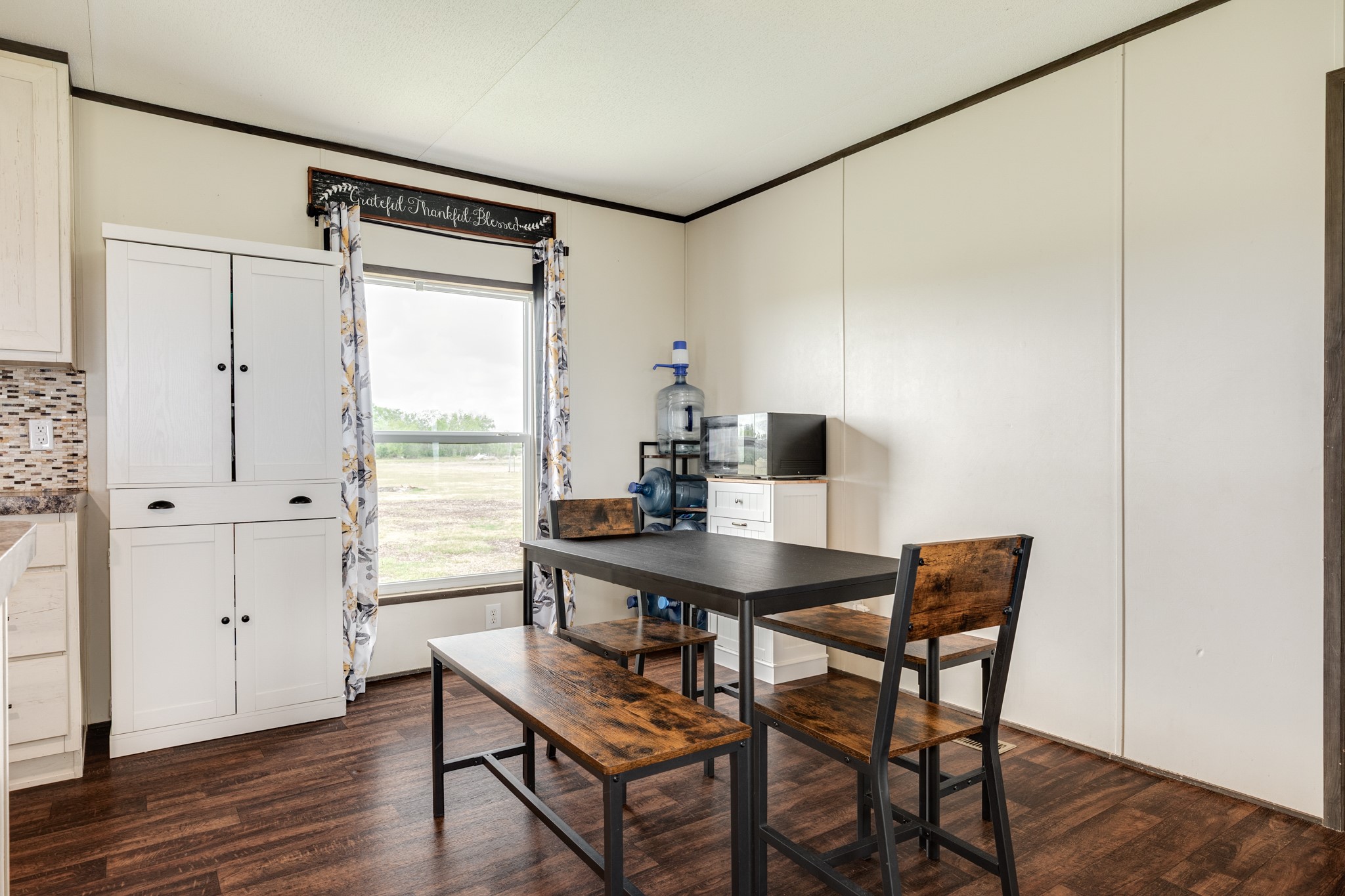 1886 County Road 212 Angleton, TX 77515 - Photo 17 of 36 a view of a workspace with furniture and wooden floor