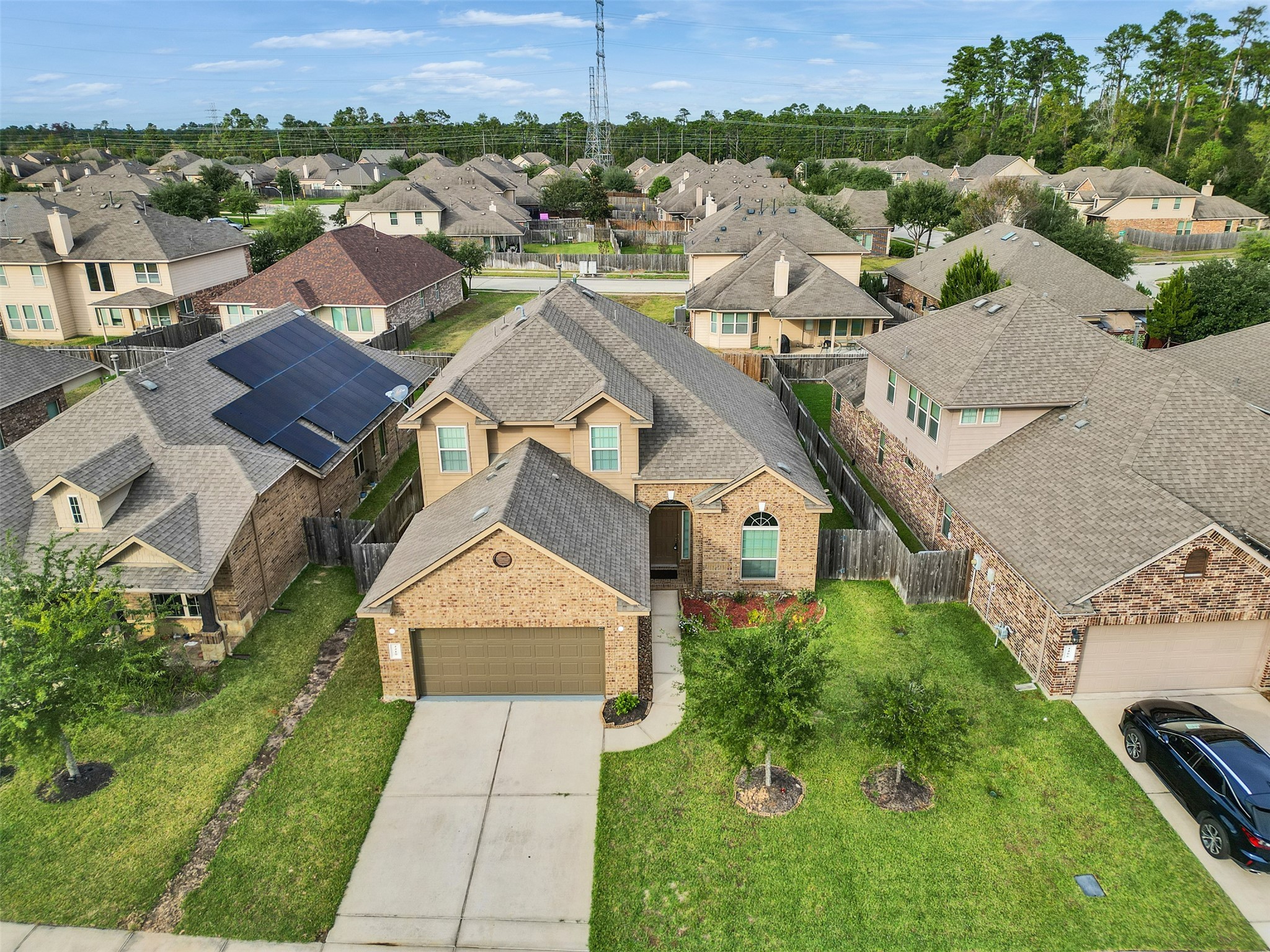 an aerial view of a house with a garden