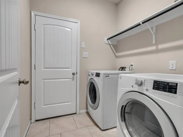 a bathroom with a sink mirror toilet and vanity
