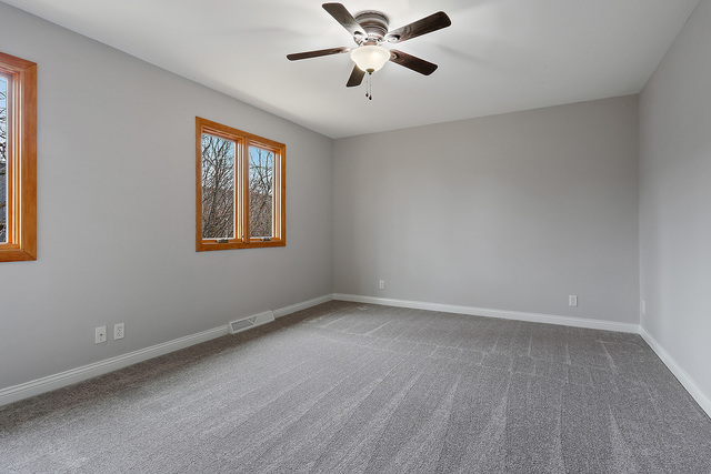 996 Schoolgate Road, Unit 4 New Lenox, IL 60451 - Photo 8 of 15 a view of an empty room with a window