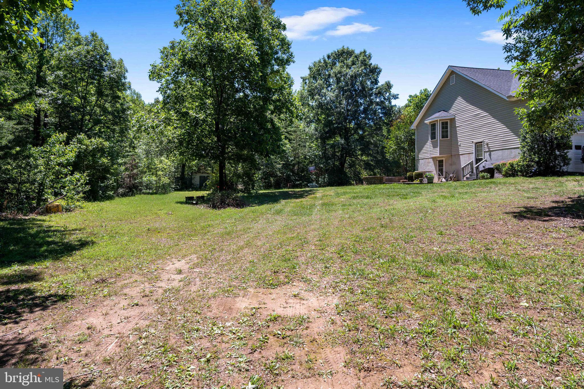 8009 Burrell Road Fredericksburg, VA 22407 - Photo 52 of 66 Spacious yard embraced by nature.