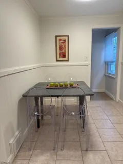 a view of a room with furniture and window