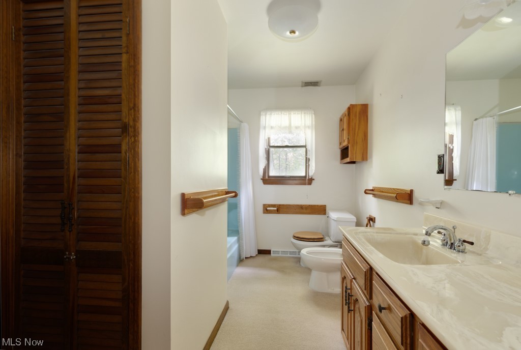 4616 Alliance Road Ravenna, OH 44266 - Photo 11 of 28 Full bathroom featuring shower / bath combo with shower, bidet, mirror, and vanity