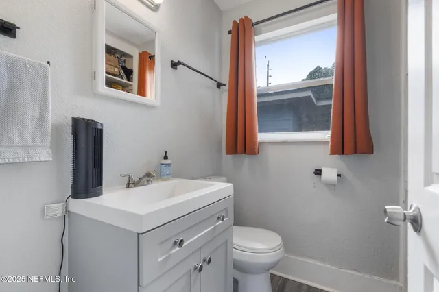 a bathroom with a sink and a toilet