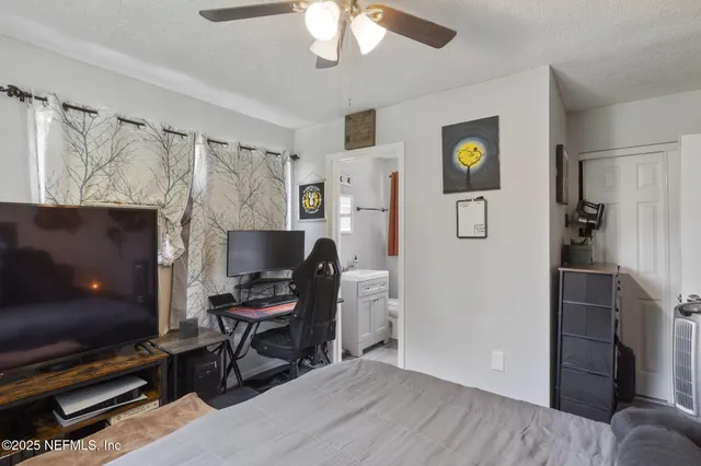 a workspace with wooden floor and furniture
