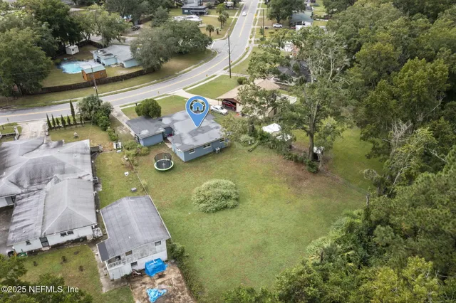 an aerial view of a house with outdoor space