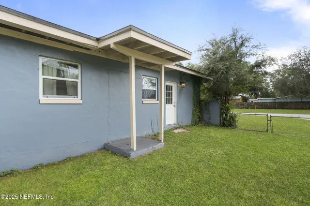 a house view with a garden space