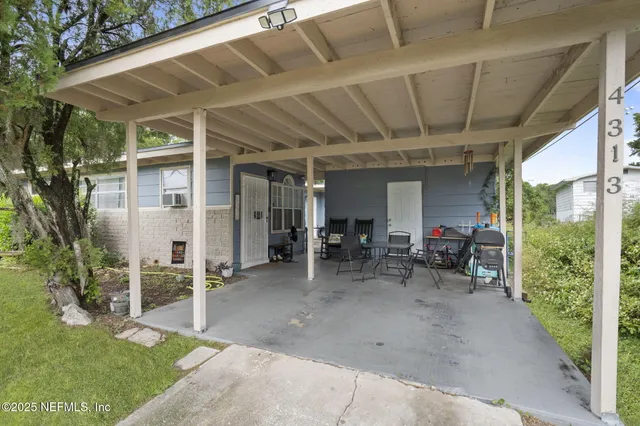 an aerial view of residential houses with city view