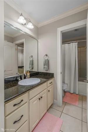 a bathroom with double sink and a mirror