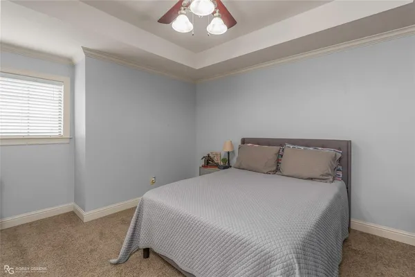 a bedroom with a bed and cabinets