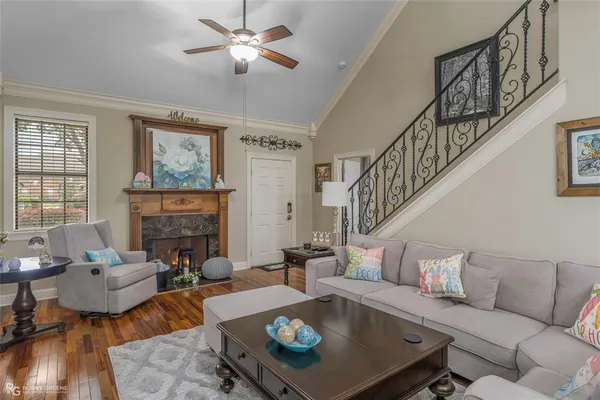 a living room with furniture and a fireplace