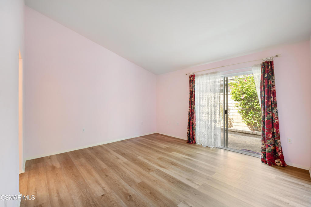 5657 Pansy Street Simi Valley, CA 93063 - Photo 15 of 32 an empty room with wooden floor and windows