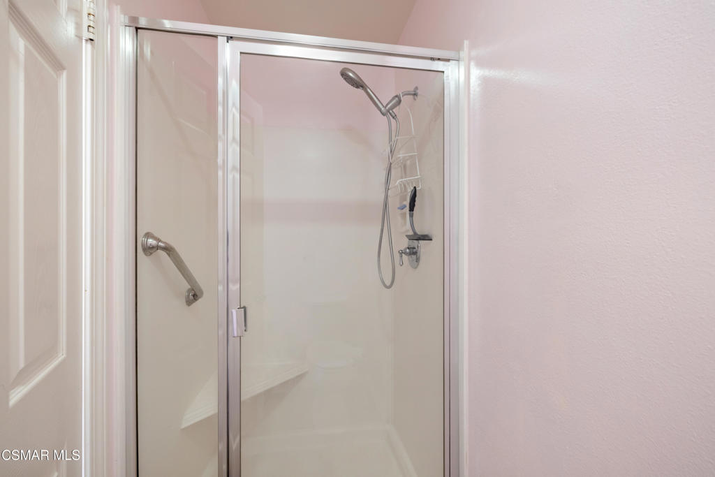 5657 Pansy Street Simi Valley, CA 93063 - Photo 17 of 32 a bathroom with a glass shower door