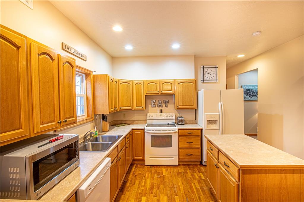 505 Greenbriar Road Dunbar, PA 15431 - Photo 13 of 43 a large kitchen with a large window and stainless steel appliances