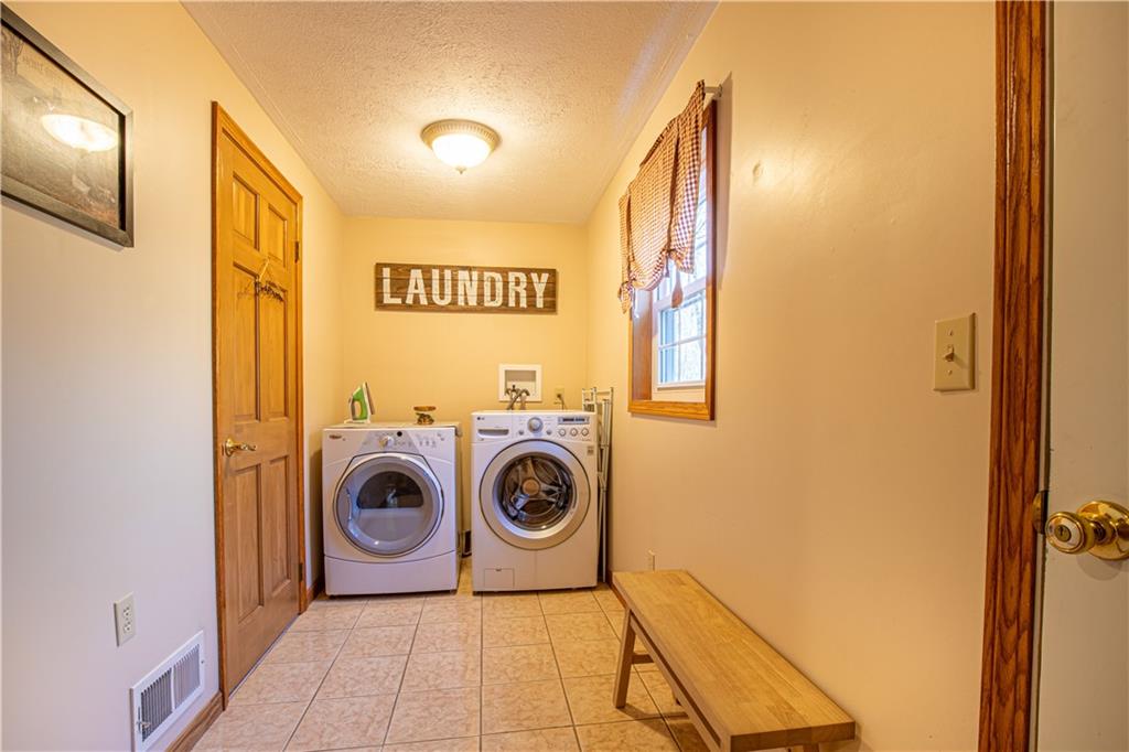 505 Greenbriar Road Dunbar, PA 15431 - Photo 20 of 43 a view of a storage & utility room with washer and dryer