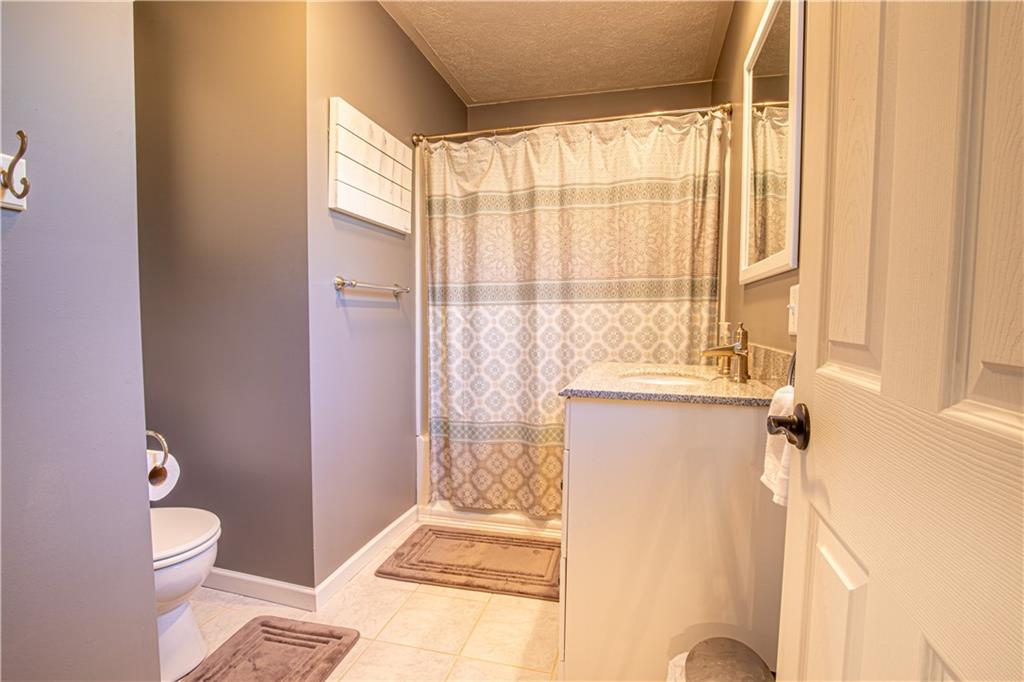 505 Greenbriar Road Dunbar, PA 15431 - Photo 23 of 43 a bathroom with a granite countertop sink toilet and shower