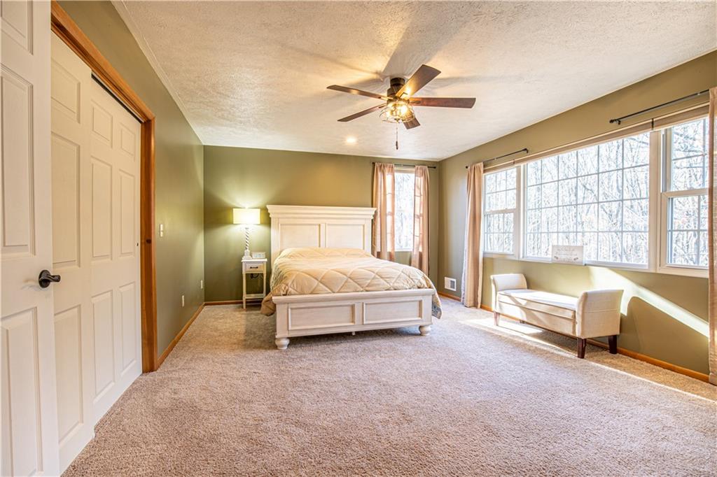 505 Greenbriar Road Dunbar, PA 15431 - Photo 26 of 43 a spacious bedroom with a bed and glass window