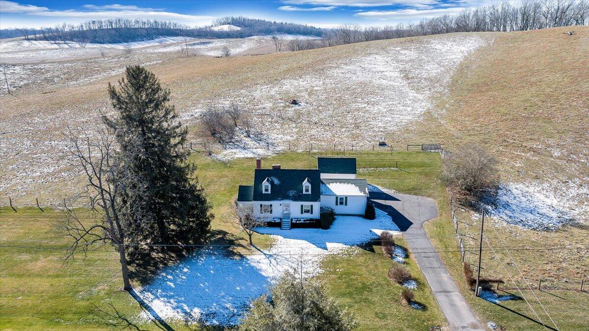 a balcony with wooden floor and lake view