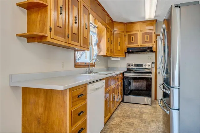 a bathroom with a toilet and a shower curtain