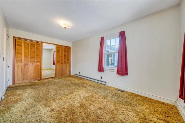 a roof deck with table and chairs