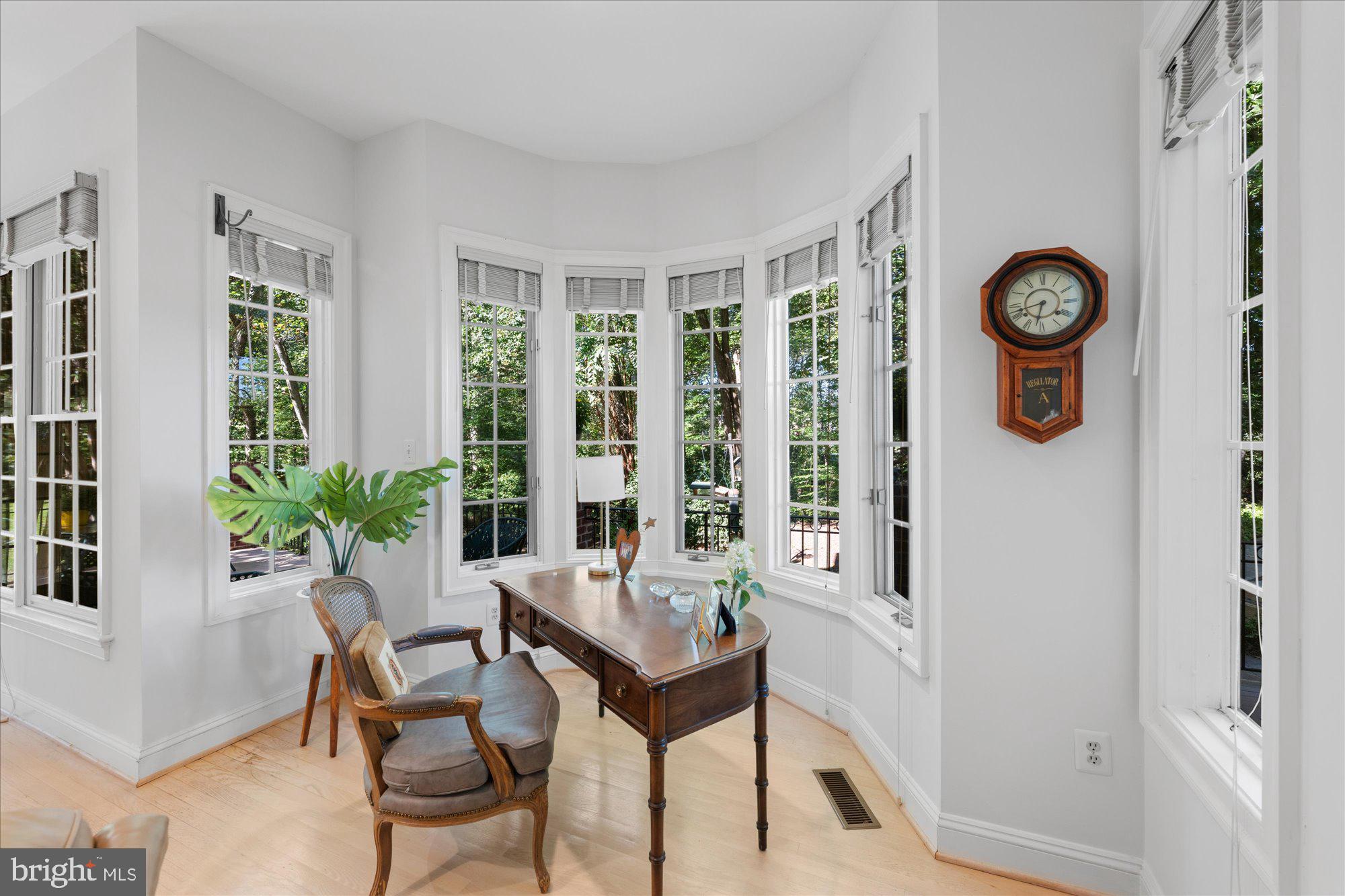 9729 Beman Woods Way Potomac, MD 20854 - Photo 13 of 41 a living room with furniture and a large window