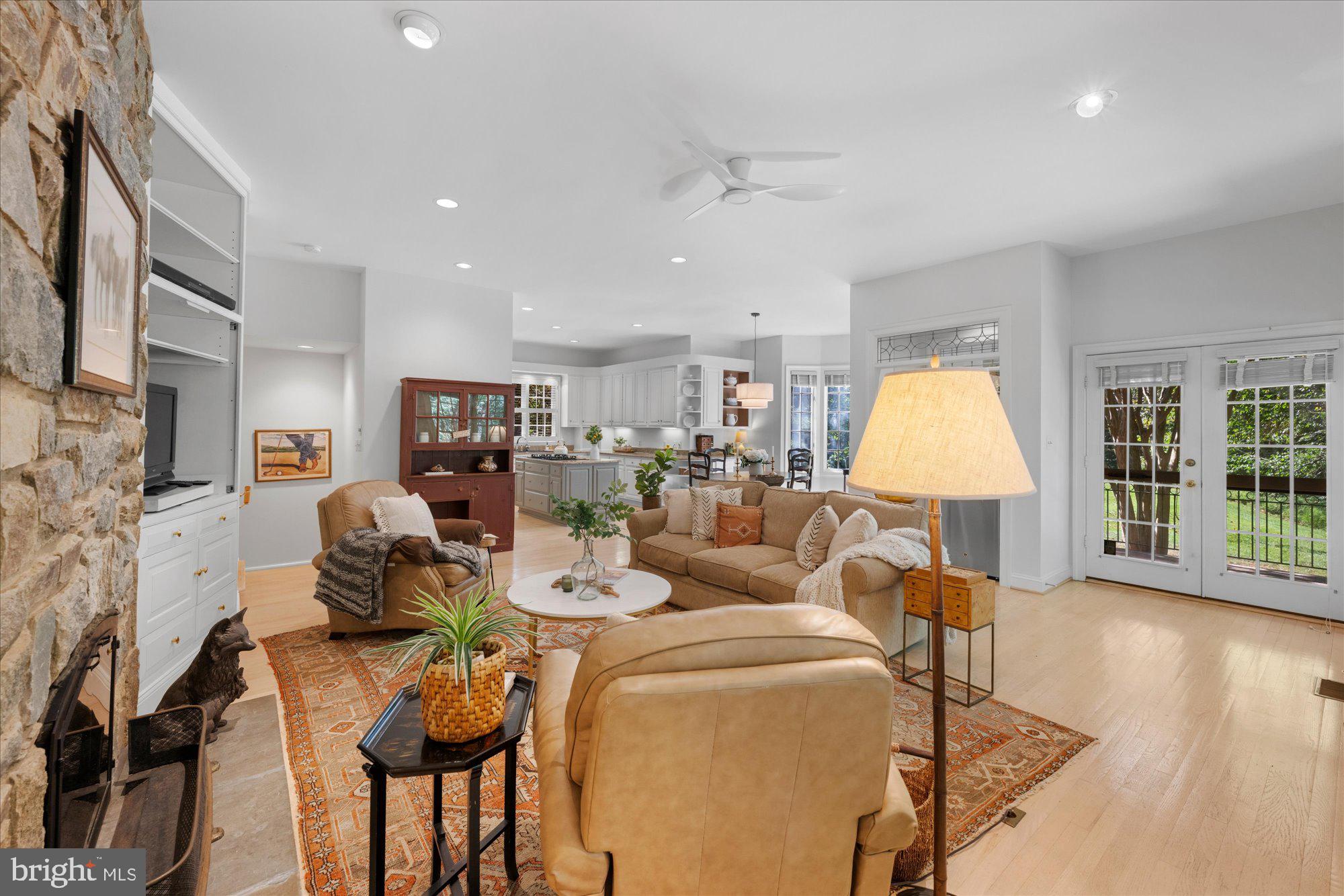 9729 Beman Woods Way Potomac, MD 20854 - Photo 14 of 41 a living room with lots of furniture and a wooden floor