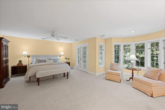 a spacious bedroom with a bed and a couch