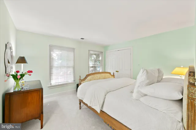 a spacious bedroom with a bed and window