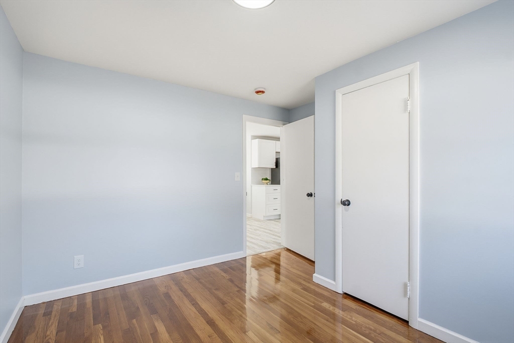 105 Denwall Drive Springfield, MA 01119 - Photo 20 of 29 a view of an empty room with wooden floor