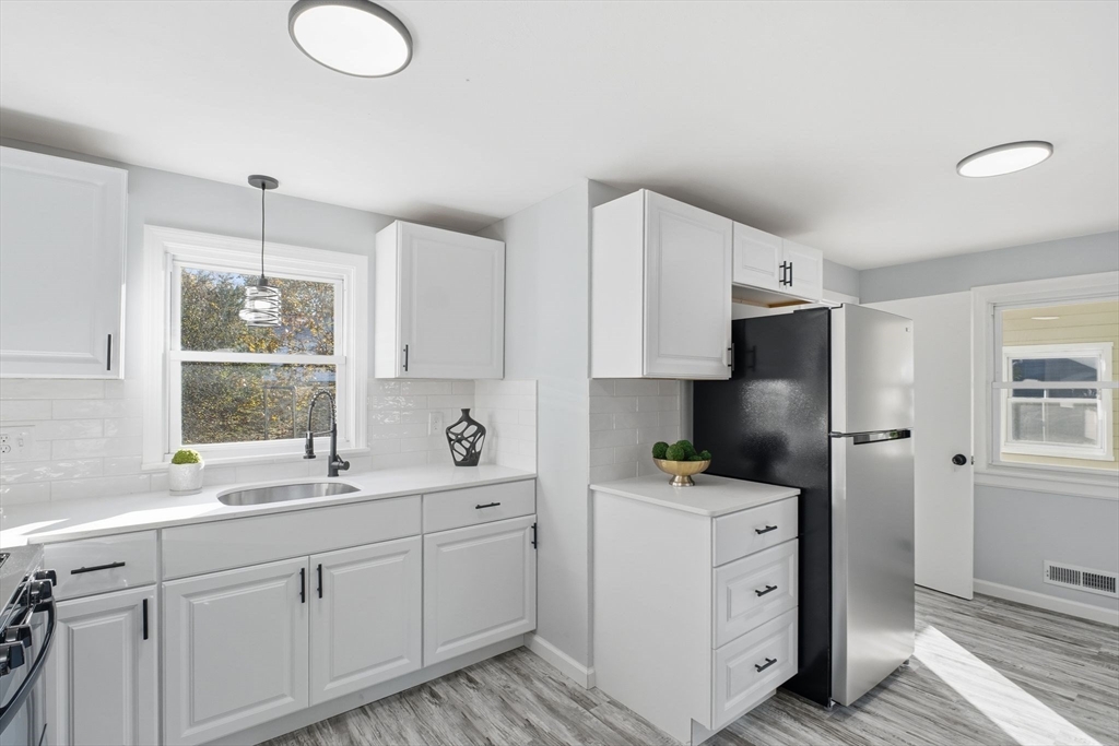 105 Denwall Drive Springfield, MA 01119 - Photo 10 of 29 a kitchen with cabinets appliances a sink and a window