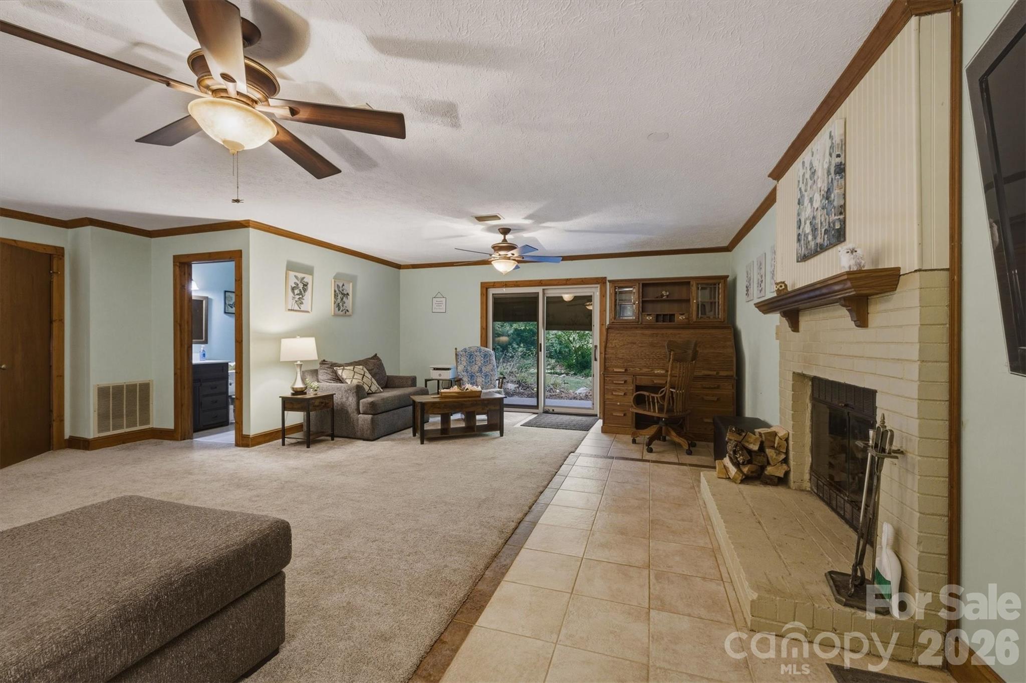 3432 Ridgewood Drive Morganton, NC 28655 - Photo 12 of 36 a living room with furniture and a fireplace