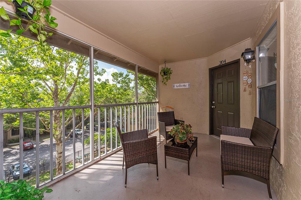 627 Dory Lane, Unit 304 Altamonte Springs, FL 32714 - Photo 11 of 28 a balcony with furniture and a potted plant