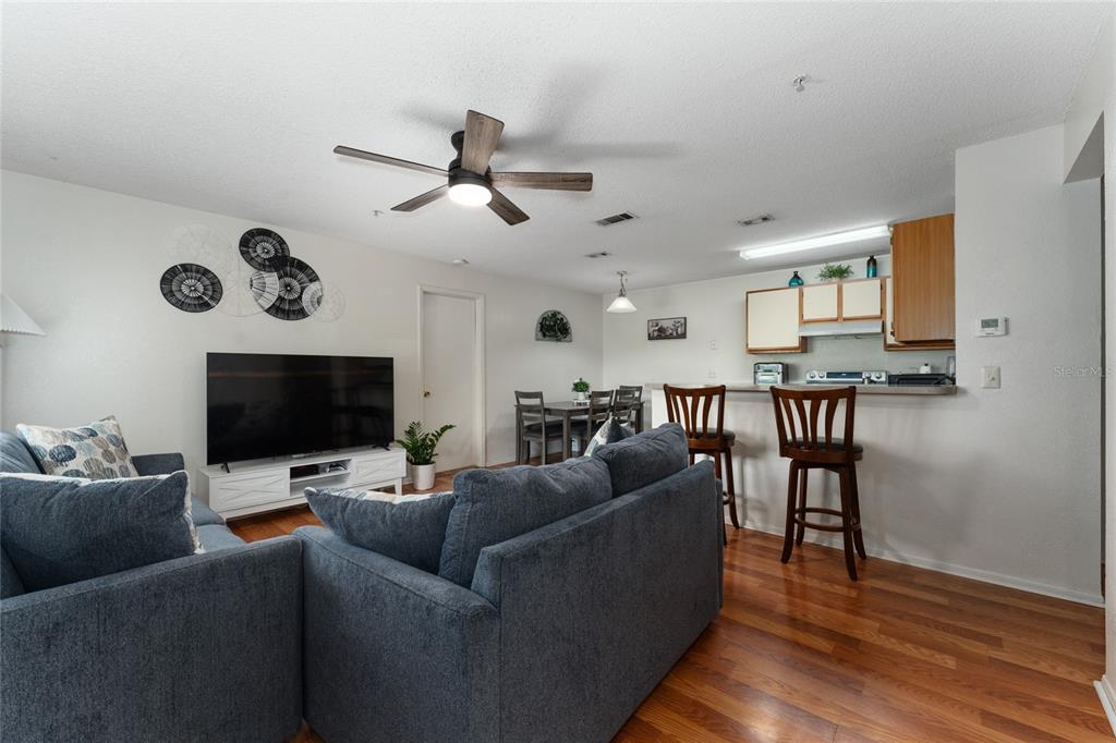 627 Dory Lane, Unit 304 Altamonte Springs, FL 32714 - Photo 14 of 28 a living room with furniture and a flat screen tv