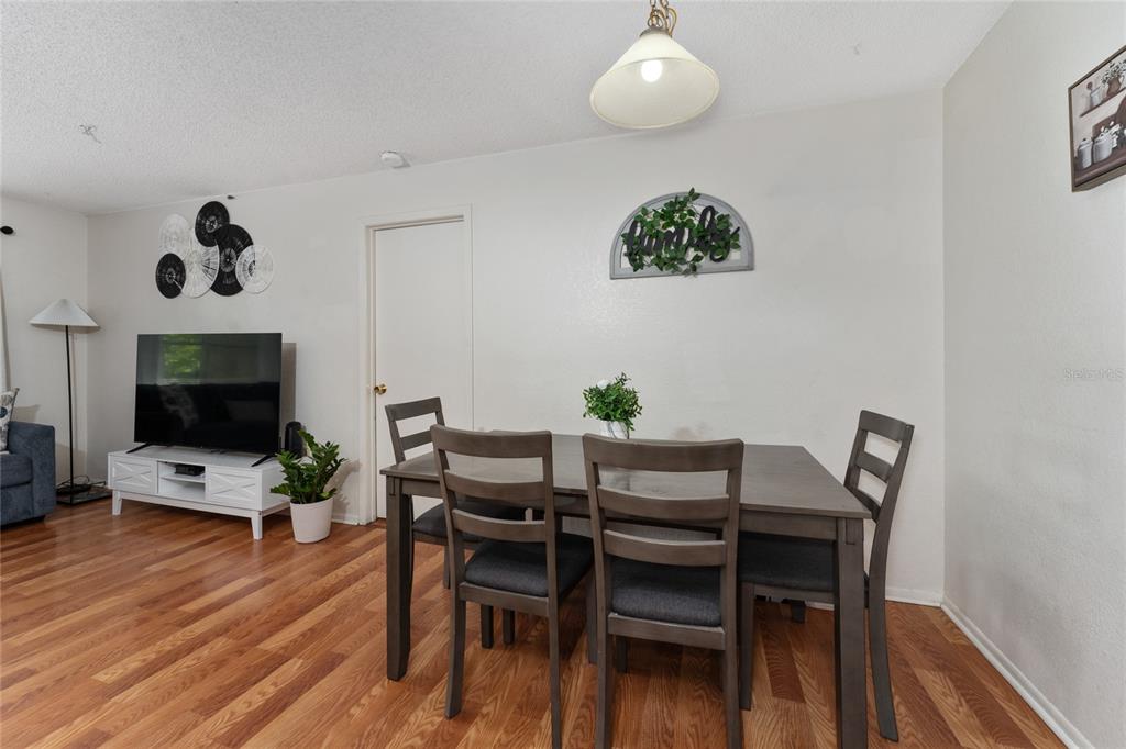 627 Dory Lane, Unit 304 Altamonte Springs, FL 32714 - Photo 16 of 28 a view of a livingroom with furniture and wooden floor
